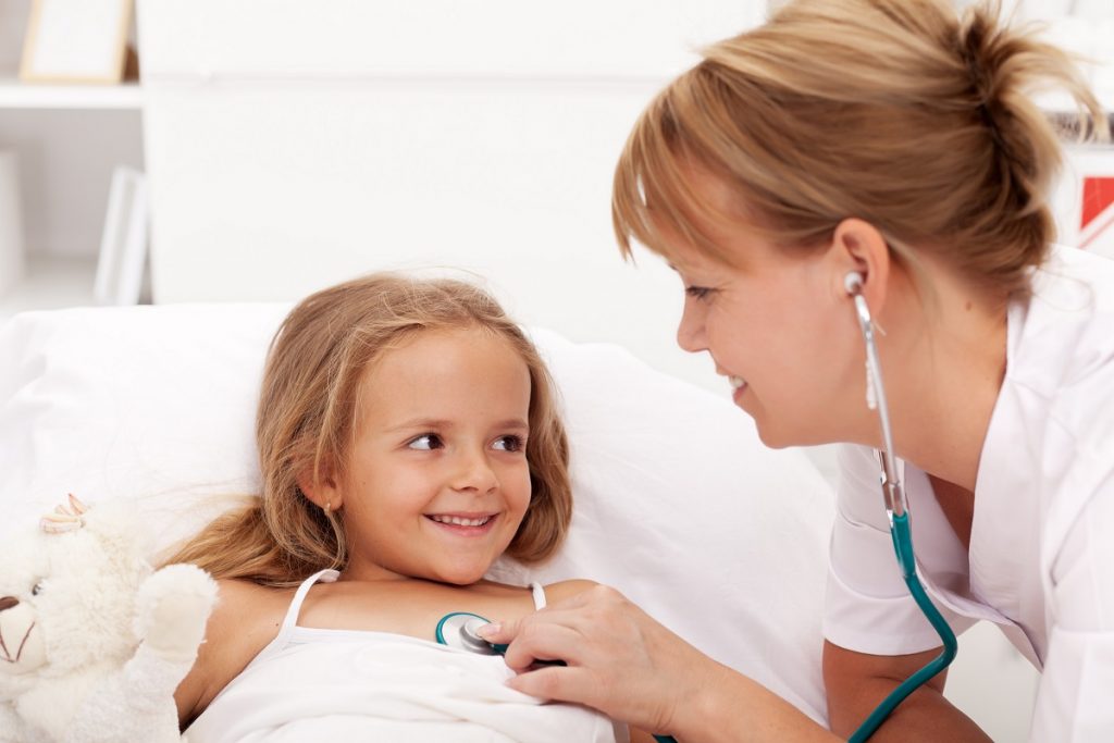 Little girl being checked by a doctor