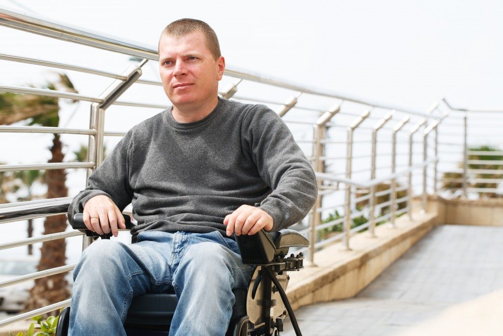 Man in wheelchair near the railing