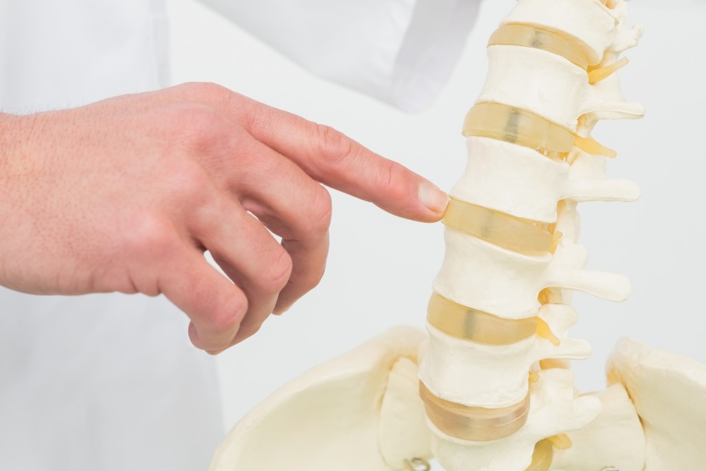 Doctor pointing at spine