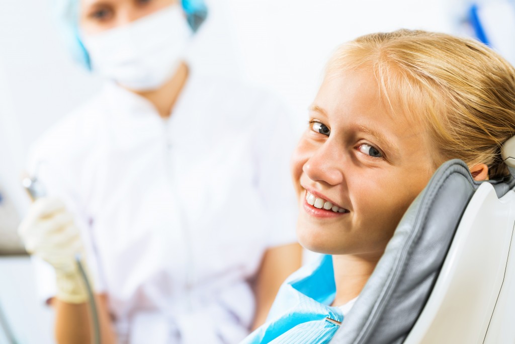 a kid with her dentist