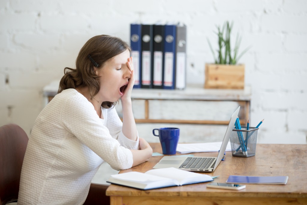 fatigued employee yawning