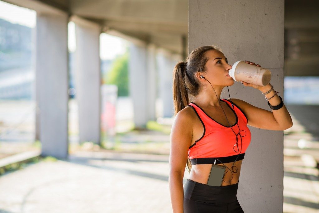 Woman having her protein drink