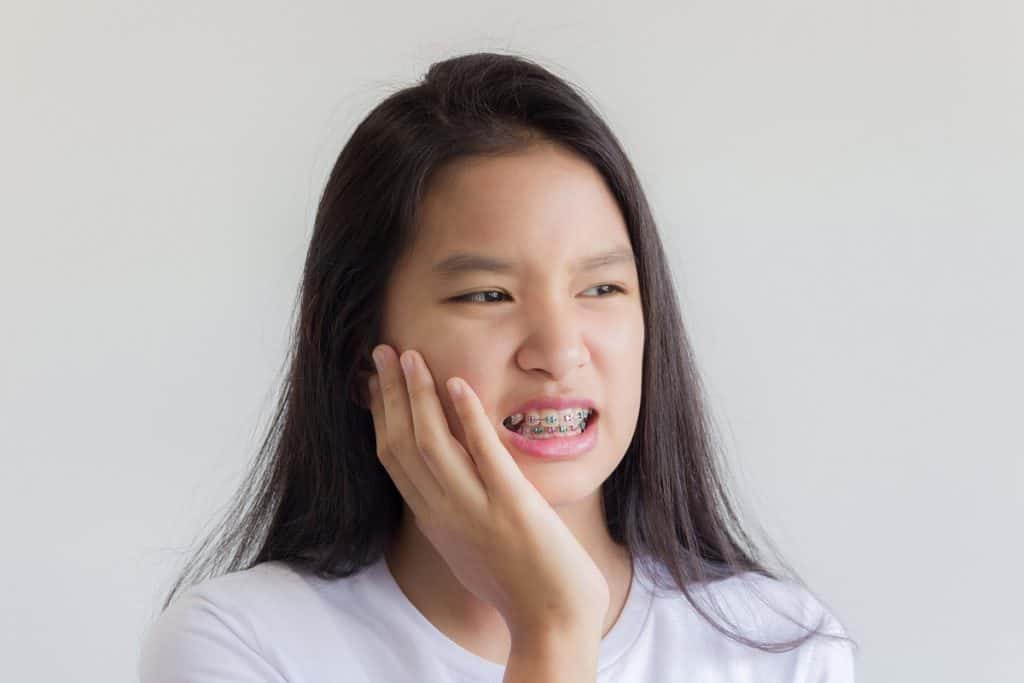Girl in pain while wearing braces