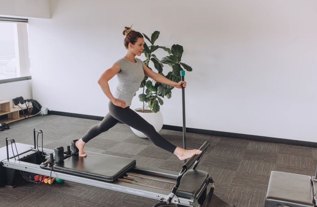 woman exercising using equipment