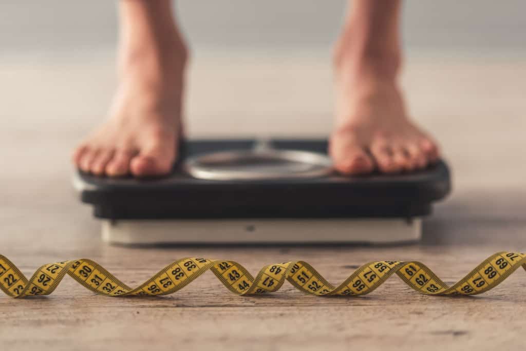 person on top of a weighing scale