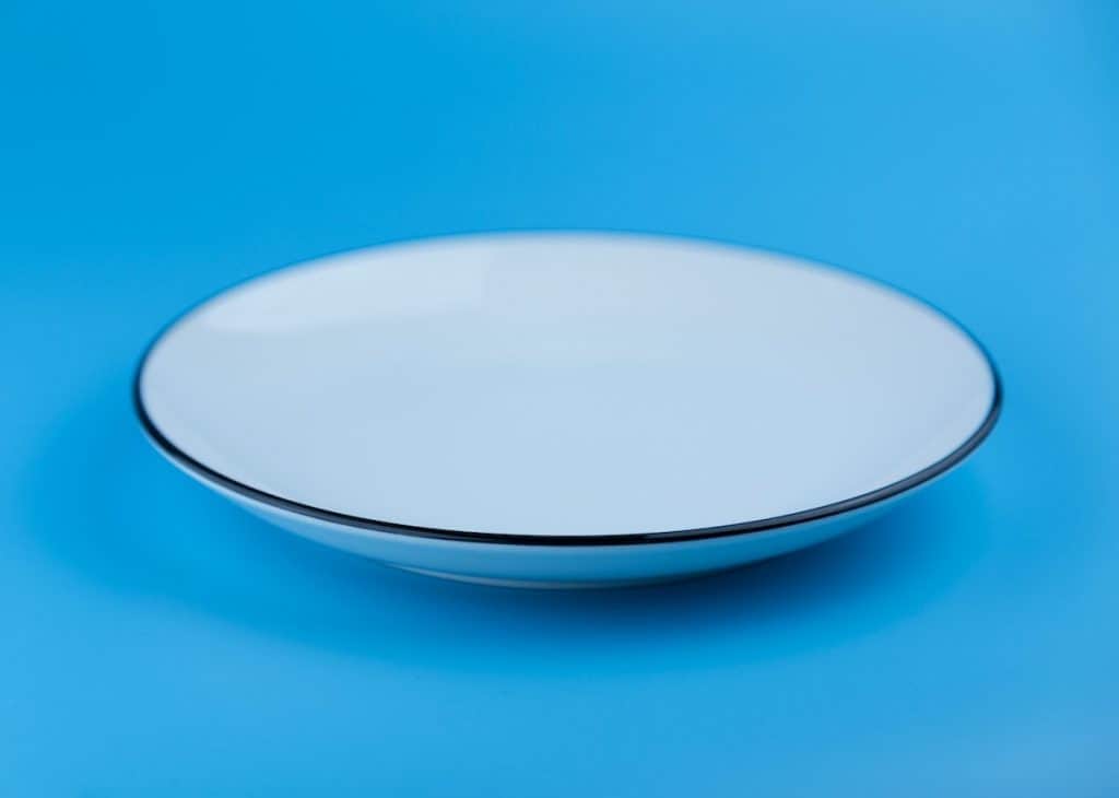 clean plate on blue background