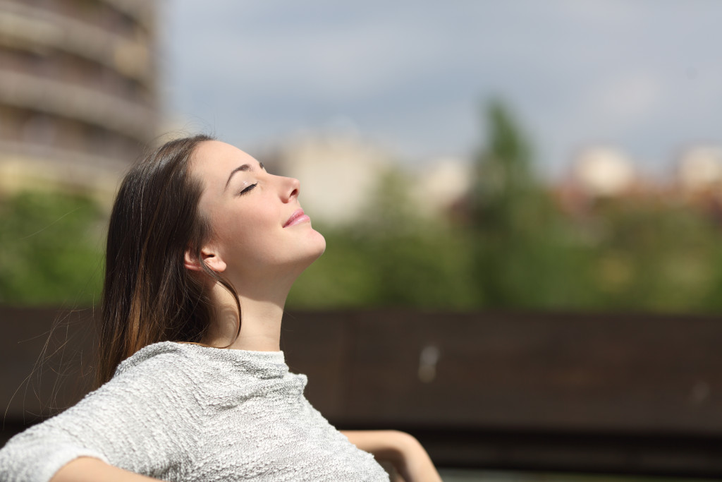 woman relaxing under summer sun