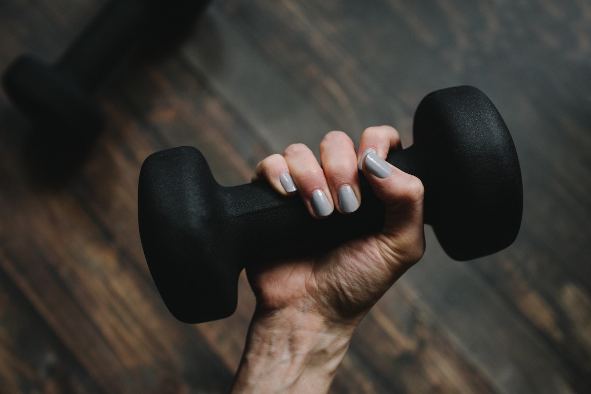 woman holding a dumbbell