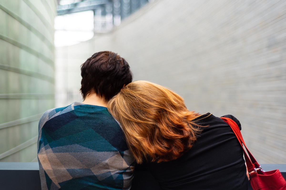 woman leaning on a man's shoulder