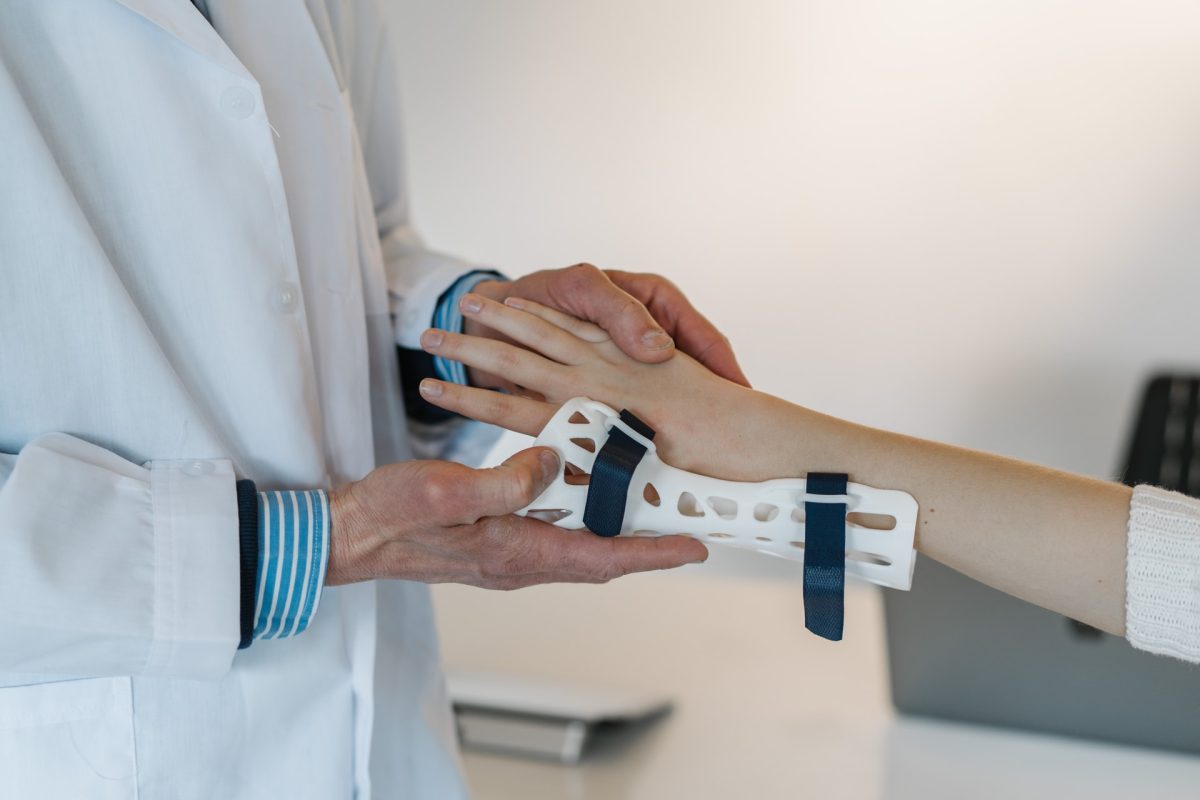 wrist support being adjusted by a doctor