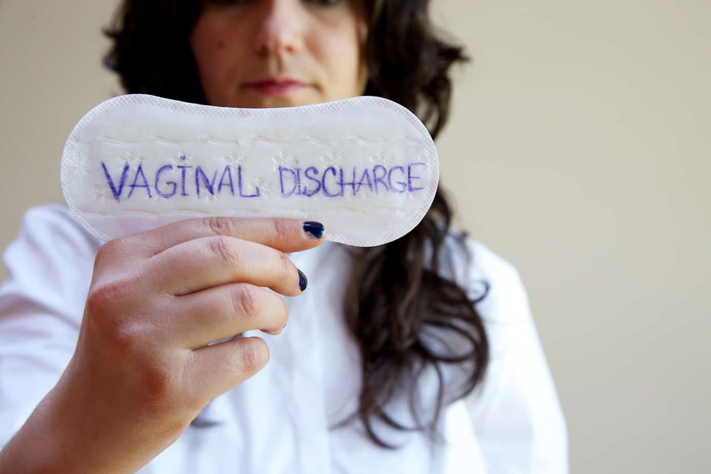 vaginal discharge written on a napkin