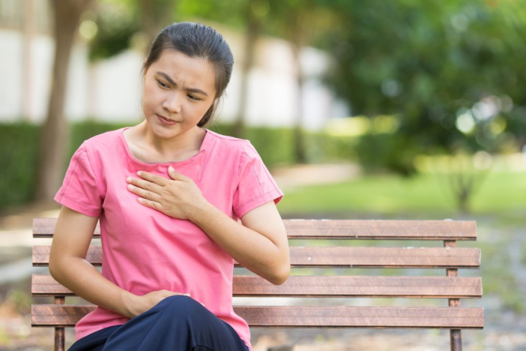 woman experiencing acid reflux