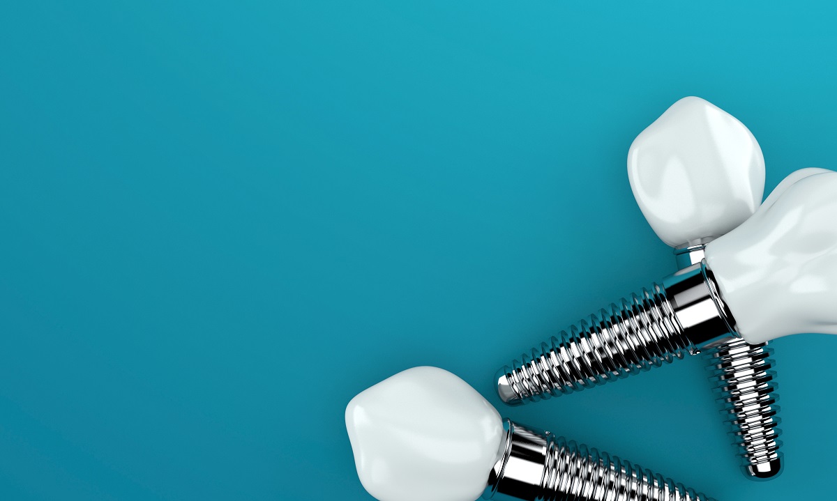 Dental implants on blue background