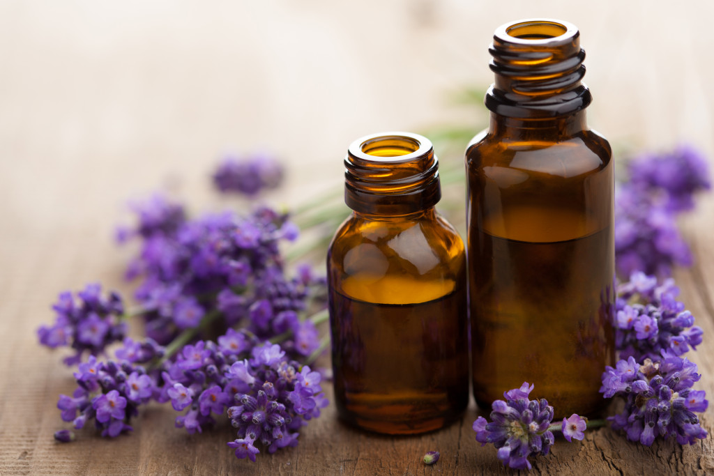 aromatherapy with vials of lavender and essential oils